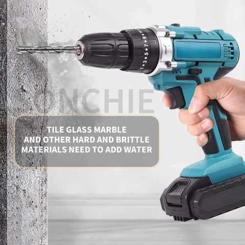 Side view of teal cordless drill with twist bit drilling into concrete wall; black chuck and battery pack