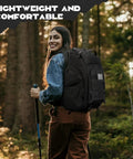Woman hiking with tactical backpack for men 40L water resistant with molle system for hiking camping and gym in forest