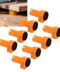 Set Of 8 19mm Nylon Bench Dogs For Woodworking, Non Marring Workbench Pegs With Clamping Pads, orange pegs demonstrating use on wood