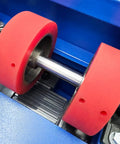 Close-up of red rollers on the Shop Grade Electric Drum Rotator And Mixer Portable Steel Roller for Heavy Duty Oil Barrels.
