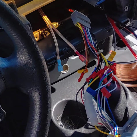 Auto wiring with Rapid Quick Splice T Tap Connectors Kit For 22-16 AWG Wire in dashboard, showcasing colorful insulated spade terminals.