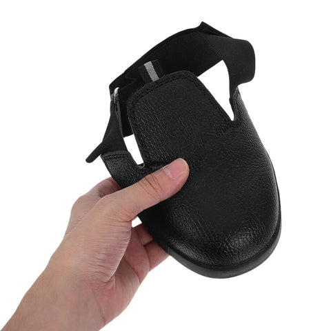 Heavy Duty Steel Toe Shoe Covers With Adjustable Strap Safety Overshoes For Work, black breathable fabric, held in hand.