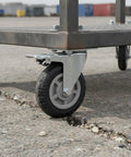 Heavy Duty Swivel Plate Caster Wheel With Standard Mount Bracket For Rough Terrain Replacement On Industrial Carts And Dollies Single Pack on cracked pavement.