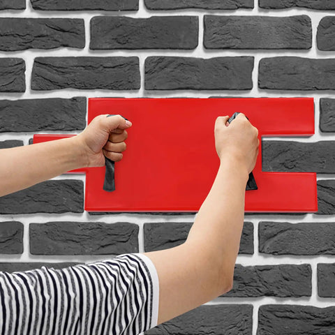Person using Durable Concrete Stamp With Realistic Texture Mat For Wall And Floor Imprinting on stone-patterned wall