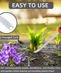 Using the Two Prong Weed Puller Tool With Soft Grip Handle Stainless Steel Dandelion Weeder in a garden with flowers.
