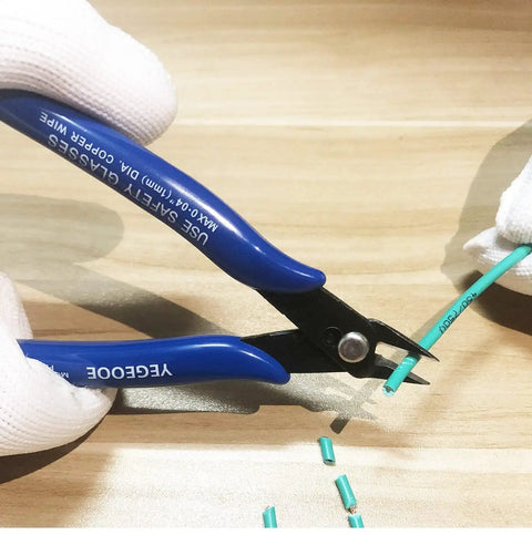 Close-up of 10 Pack Flush Wire Cutters Pliers Set With Diagonal Side Cutting Jaws For Jewelry Making And Crafts Ultra Sharp High Carbon Steel Blades Five Inch Palm Size For Clean Precise Cuts trimming wire with blue handles.
