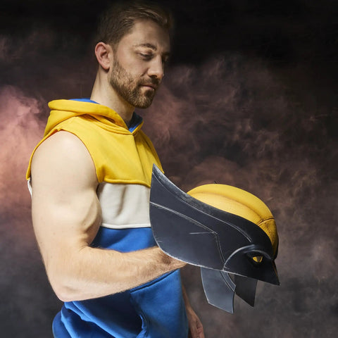 Legit Screen Accurate Wolverine Premium Roleplay Mask Featuring Authentic Movie Details And Officially Licensed Construction For Top Shelf Adult Collectibles And Zero Fuss Cosplay held by a man in a yellow and blue outfit.