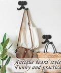 Heckin Durable Four Piece Cast Iron Beard Wall Hooks For Old School Farmhouse Charm and Dang Tough Rustic Decor Hanging Rack For Coats Scarves Towels Keys With Mounting Hardware Included, mounted with bags.