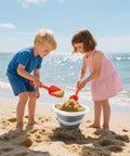 Kids playing on the beach with sand toys next to 5L Collapsible Bucket With Handle For Car Wash And Cleaning, Foldable Mop Bucket