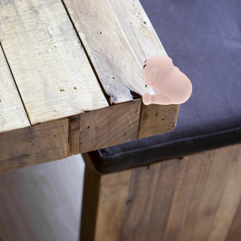 Silicone Corner Protectors Cartoon Puppy Design 8 Pack Edge Guards for tables shown on wooden table corner