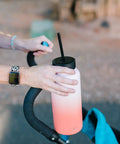 Person holding a bottle with Insulated Leak Proof Straw Lid For Summit And Hydro Flask Wide Mouth Bottles On The Go Keeps Drinks Cold Longer Splash Proof Cap Midnight Black Road Trip Ready