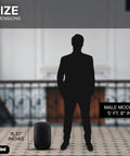 Silhouette of a male model standing beside an 8 Inch Powered PA Speaker With 300 Watts, highlighting size comparison on tiled floor.