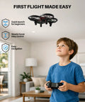 Young boy using Kid Friendly Indoor Drone With Obstacle Avoidance And 20 Minute Flight Time With Two Batteries Included indoors