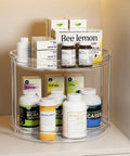 Smooth Spinning Two Tier Lazy Susan Turntable Organizer For Kitchen Pantry Fridge And Bathroom Vanity Spice Rack Storage Total No Fuss Slick Compact 9.25 Inch Dual Pack System with health supplements on a clear organizer.
