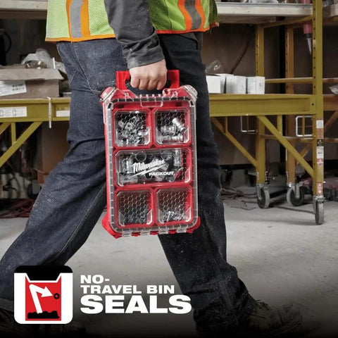Person carrying a Packout Compact Low-Profile Tool Organizer with Transfer Tank Storage, impact-resistant and weather-sealed gear bin.