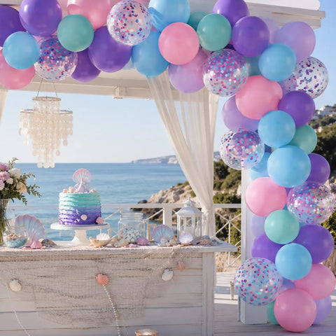 Sea Theme Confetti Balloons Party Kit 50Pcs 12 Inch Iridescent Pink Purple Blue Teal For Princess Birthday Bash Decor Ocean Theme Party Supplies Set With Colorful Confetti Balloons And Ribbon displayed at an oceanfront party setup.
