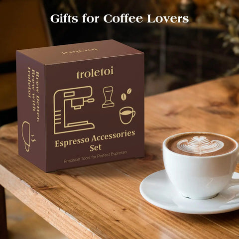 7 Piece Espresso Tools Kit For 54mm Breville Portafilters Includes 53.3mm Tamper Distributor Puck Screen Dosing Funnel WDT Tool Perfect Home Barista Gear displayed in box on table next to latte.