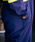 Side view of Flame Resistant Hi Vis Coverall For The Jobsite Navy Blue 88 Cotton 12 Nylon Twill 7 Oz Arc Flash Safe 12 Cal Per Cm2 ATPV