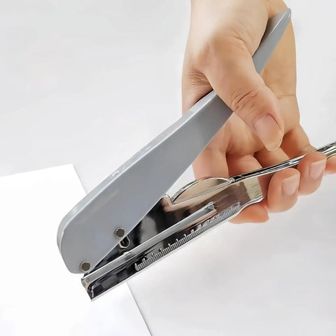 Hand using Heavy Duty One Hole Punch For Crafting And Card Making, Portable Handheld Paper Puncher With One Quarter Inch Hole Size on paper