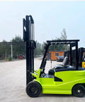 High Capacity Electric Side Loading Forklift For Seamless Warehouse Storage And Tough Construction Sites Built To Smash Heavy Cargo Without Breaking A Sweat, green side view.