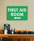 Left Arrow First Aid Room Outdoor Medical Safety Sign 8x12 Aluminum Wall Decor above a wooden shelf