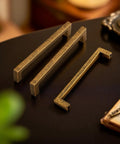 10 Pack Antique Brass Cabinet Pulls Square Design With Five Inch Center To Center About Five And Two Fifths Inches Long Solid Zinc Alloy Kitchen Cabinet Handles Polished Gold Drawer Pulls Hardware, on a table