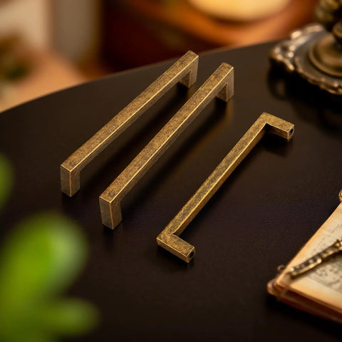 10 Pack Antique Brass Cabinet Pulls Square Design With Five Inch Center To Center About Five And Two Fifths Inches Long Solid Zinc Alloy Kitchen Cabinet Handles Polished Gold Drawer Pulls Hardware, on a table
