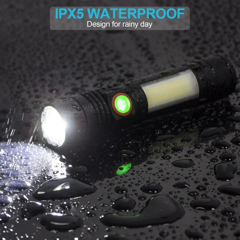 Beast Bright LED Flashlight With Magnetic Tail COB Sidelight Zoomable Beam Waterproof IPX5 shown in rain