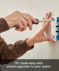 Person installing Lever Edge 15 Amp Single Pole Rocker Switch 10 Pack White Model E5601 MW Fast Wire Insertion on wall
