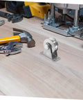 Stainless Steel Groove Wheel Pulley For Sliding Doors And Barn Doors Heavy Duty Track Wheel on a wooden surface with tools