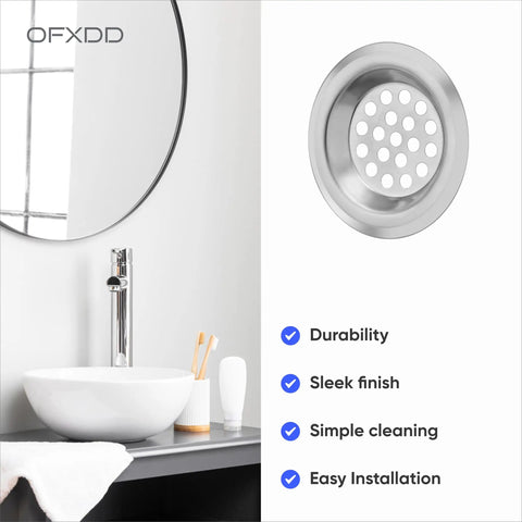 Hair Catcher For Shower Drain And Sink Strainer, Compact 2.5 Inch Flat Cover in a sleek silver finish installed in a modern sink.