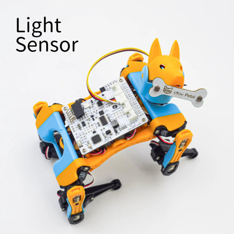 Orange robotic dog with attached All In One Sensor Pack For Robotics IoT And AI With Light Touch Gesture Proximity Motion And Infrared Distance Sensors