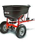 Heavy Duty 130 Lb Broadcast Spreader For Seed Fertilizer Salt Ice Melt With Universal Hitch shown on angle with wheels and hitch