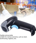 Close-up of black 2D Barcode Scanner With Lightning Fast Accurate Scanning Wired USB Handheld Reader in warehouse setting