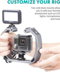Hands holding underwater GoPro rig with cold shoe mounts and wrist strap for HERO3 to HERO8 and Osmo Action, aluminum tray.