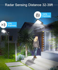 Night view of Ultra Bright Solar Street Light Dusk To Dawn Outdoor Lighting illuminating house entrance and path, 6000K white light.