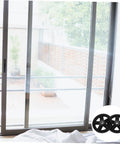 Kickass Heavy Duty Sliding Door Pulley Wheel Kit With Rigid Casters For Barn Door Track System shown with sliding door and wheels.