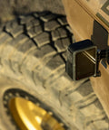 Premium Flat And Curved Surface Action Camera Mounts Featuring Industrial Strength Adhesive that sticks to a vehicle tire.