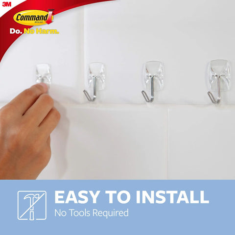 Person installing Damage Free Hanging For Small Wall Hooks Clear Refill Adhesive Strips Pack Of 16 Ideal For Dorm Room Decor