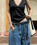 Vintage Industrial Waist Belt Featuring Heavy Copper Hardware And Flowing Tassels With Easy Adjustable Strap In Warm Coffee Brown For Daily Wear That Gives Serious Drip worn with casual outfit.