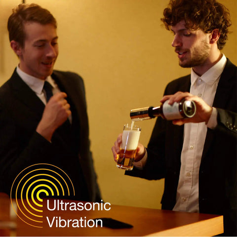 Men using No Brainer Push Button Beer Foam Maker to create thick frosty heads on craft ales at a social gathering.