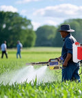 Farmer using Portable Pulse Water Mist Fogger Electric Sprayer with 15L stainless steel tank in field.