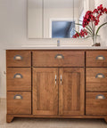 Antique Brass Cabinet Handle Set 2 Pack Shell Drawer Pulls on wooden bathroom vanity for classic style and solid grip.