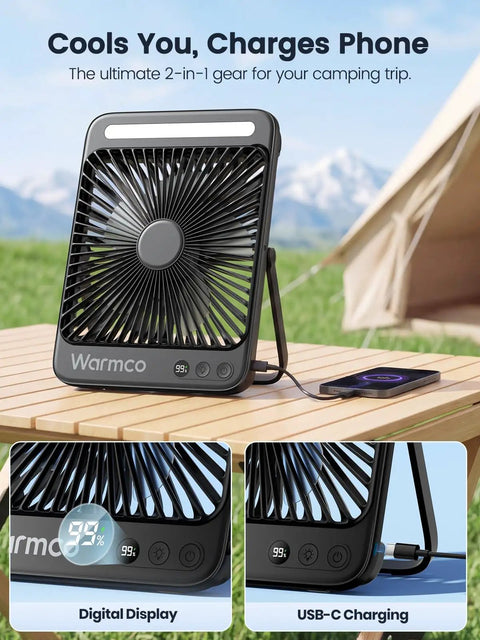 20,000mAh Portable Camping Fan With LED Lantern on wooden table showing digital display and USB-C charging with phone, outdoor setting