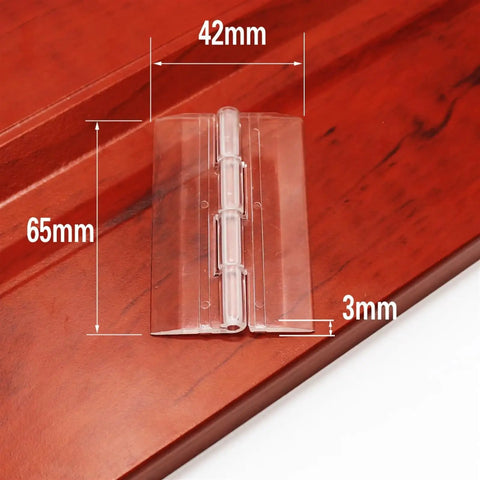 Pack Of 10 Transparent Plastic Folding Hinges In 25x33 30x33 38x45 And 65x42 Sizes, clear acrylic hinge on wood surface