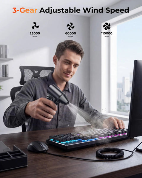 Man using Powerful High Speed 110000 RPM Electric Air Duster With Brushless Motor 3 Speed Settings to clean computer keyboard