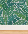 Heavy Duty Tropical Leaf Exotic Textured Vinyl Wallpaper in green with slick leather finish on wall, 2 x 27 ft roll.