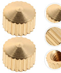Golden metal nuts from 20 Piece Clock Nut Set For Repair And DIY Projects, showing close-up details and ridges.