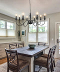 Dining room with 37.4 Inch Black Farmhouse Chandelier With 8 Candle Style Lights over rustic table