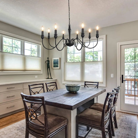 Dining room with 37.4 Inch Black Farmhouse Chandelier With 8 Candle Style Lights over rustic table